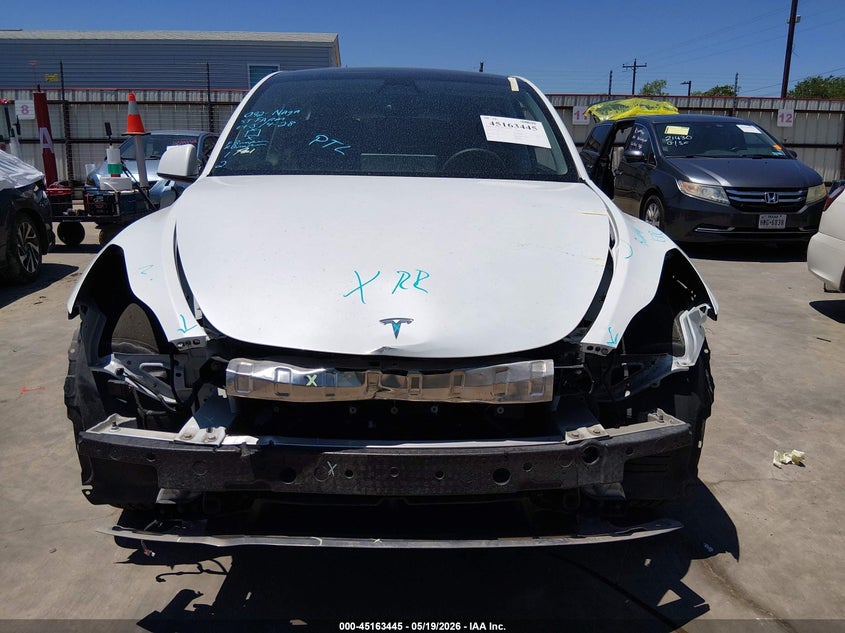2023 Tesla Model y VIN 7SAYGDEE4PA076343 IAAI salvage auction — FRONT & REAR, Original (Texas), sold $9,050 on 2026-07-07 (photo 6)
