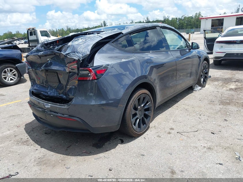 2023 Tesla Model y VIN 7SAYGAEE5PF854991 IAAI salvage auction — REAR END, Rebuildable (Florida), sold $9,200 on 2026-07-23 (photo 4)