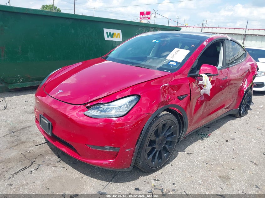 2023 Tesla Model y VIN 7SAYGDEE7PA129682 IAAI salvage auction — LEFT REAR, Salvage (Texas), sold $7,600 on 2026-07-16 (photo 2)