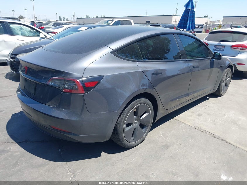 2023 Tesla Model 3 VIN 5YJ3E1EA8PF608687 IAAI salvage auction — REAR END, Salvage Title, sold $5,500 on 2026-08-30 (photo 4)