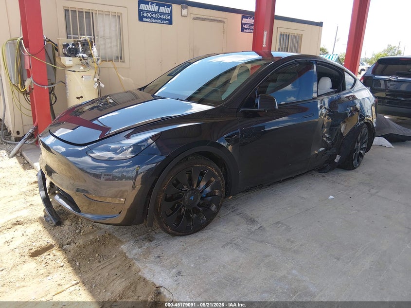 2024 Tesla Model y VIN 7SAYGDEF4RF029389 IAAI salvage auction — WATER/FLOOD, Rebuildable (Florida), sold $4,650 on 2026-07-28 (photo 2)