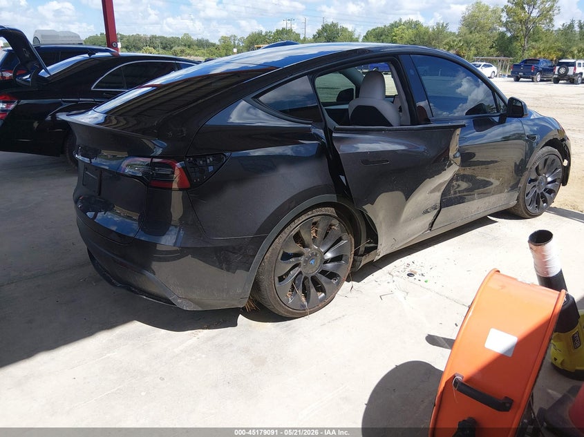 2024 Tesla Model y VIN 7SAYGDEF4RF029389 IAAI salvage auction — WATER/FLOOD, Rebuildable (Florida), sold $4,650 on 2026-07-28 (photo 4)