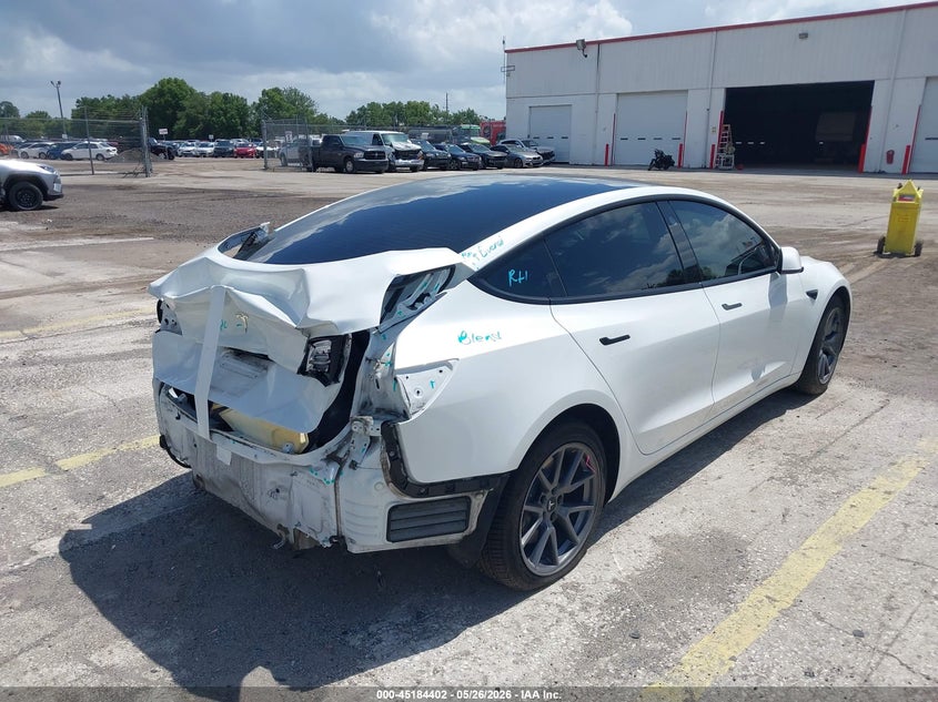 2021 Tesla Model 3 VIN 5YJ3E1EA5MF977440 IAAI salvage auction — REAR END, Rebuildable (Florida), sold $5,250 on 2026-07-16 (photo 4)