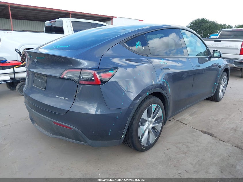 2023 Tesla Model y VIN 7SAYGDEE3PA175915 IAAI salvage auction — SIDE, Original (Texas), sold $16,450 on 2026-07-16 (photo 4)