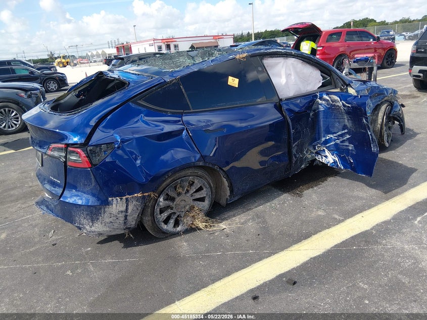 2025 Tesla Model y VIN 7SAYGDEE1SA338814 IAAI salvage auction — BIO HAZARD, Certificate Of Destruction (Florida), sold $125 on 2026-07-23 (photo 4)