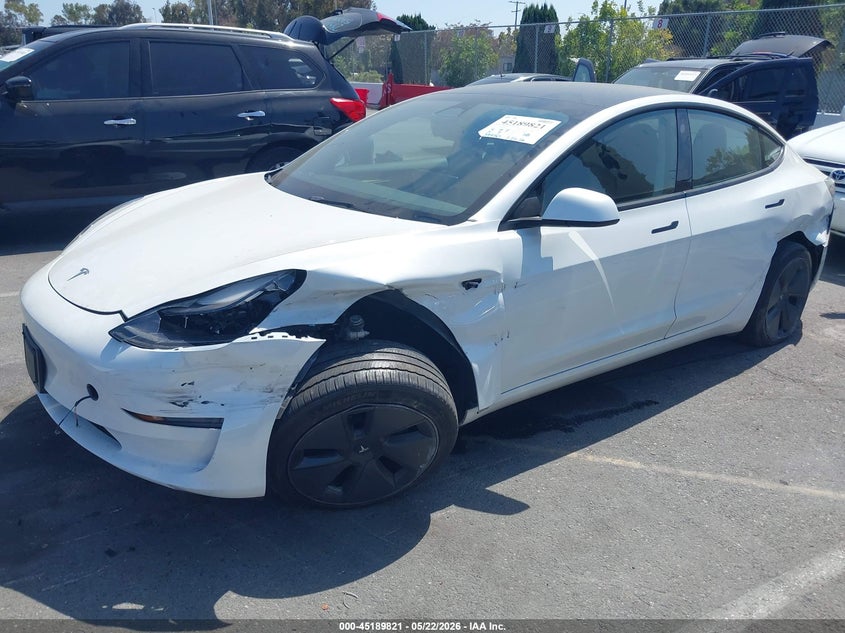 2023 Tesla Model 3 VIN 5YJ3E1EA6PF610132 IAAI salvage auction — SIDE, Salvage (California), sold $8,500 on 2026-07-16 (photo 2)