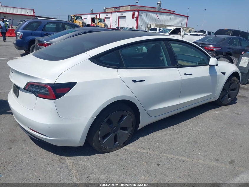 2023 Tesla Model 3 VIN 5YJ3E1EA6PF610132 IAAI salvage auction — SIDE, Salvage (California), sold $8,500 on 2026-07-16 (photo 4)