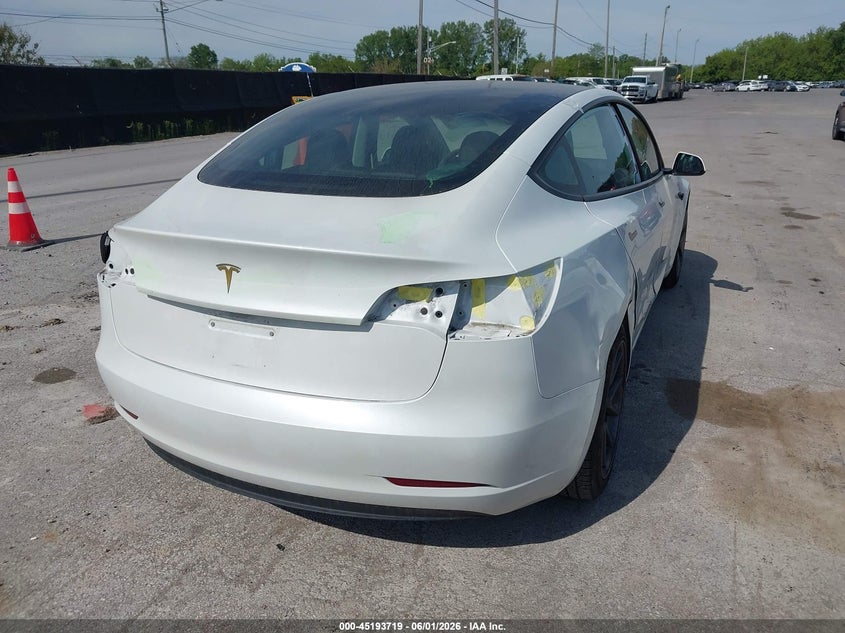 2023 Tesla Model 3 VIN 5YJ3E1EA9PF568801 IAAI salvage auction — SIDE, Salvage Title, sold $8,900 on 2026-07-15 (photo 4)