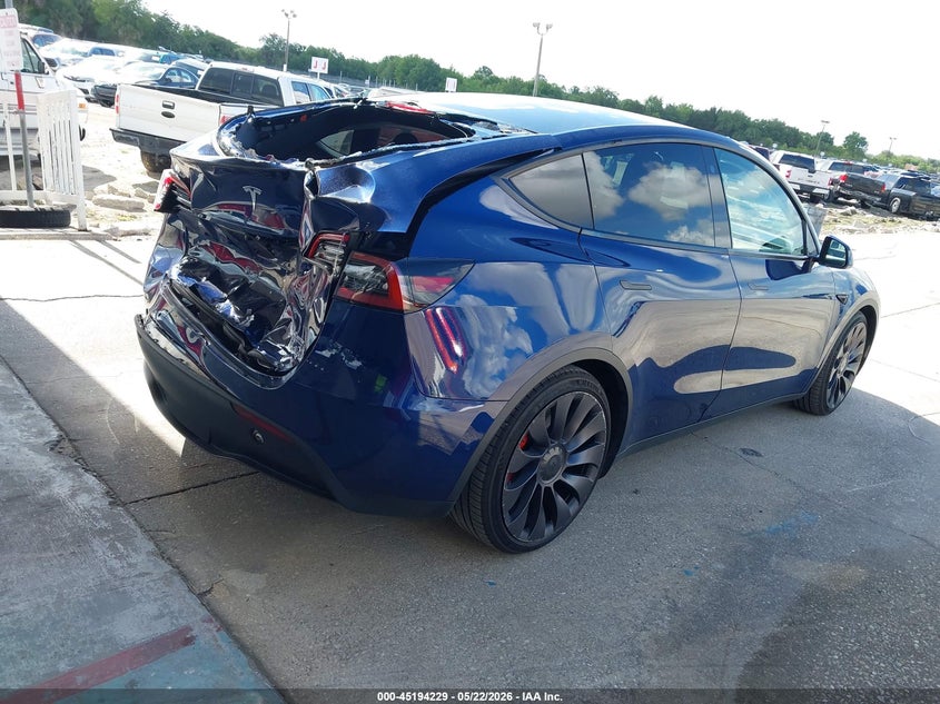 2022 Tesla Model y VIN 7SAYGDEF6NF382419 IAAI salvage auction — REAR END, Rebuildable (Florida), sold $11,950 on 2026-07-09 (photo 4)