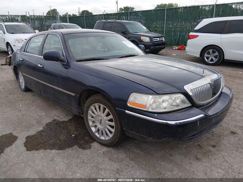 2004 Lincoln TOWN CAR VIN 1LNHM83W94Y670610 IAAI salvage auction — SIDE, Salvage (Kansas), sold $300 on 2026-09-04 (photo 1)