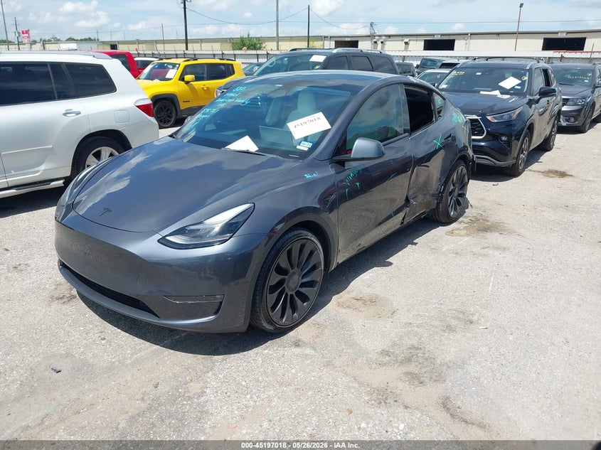 2023 Tesla Model y VIN 7SAYGDEF4PF838761 IAAI salvage auction — SIDE, Salvage Title, sold $12,300 on 2026-07-08 (photo 2)