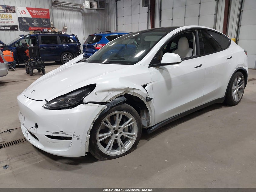 2023 Tesla Model y VIN 7SAYGDEE6PF675621 IAAI salvage auction — SUSPENSION, Salvage (North Dakota), sold $8,900 on 2026-07-24 (photo 2)