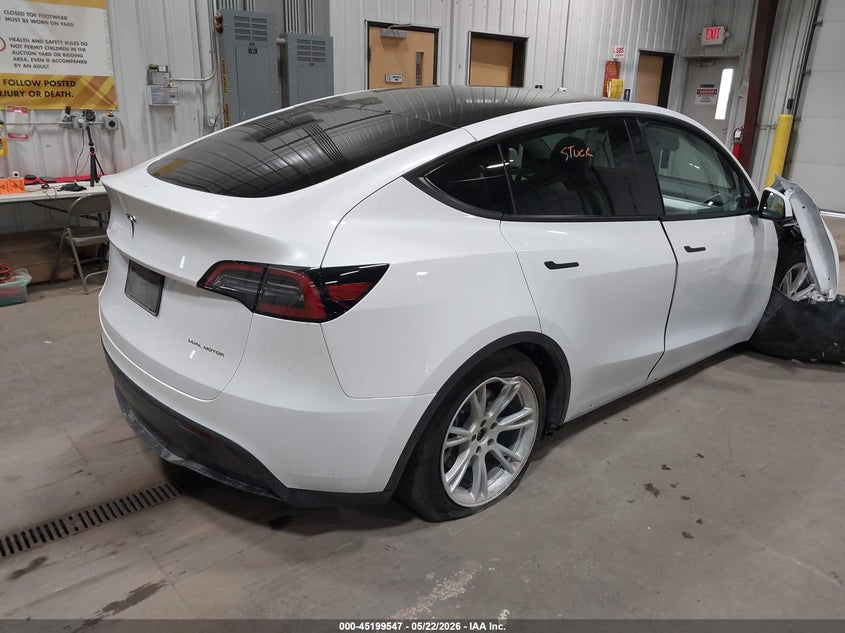 2023 Tesla Model y VIN 7SAYGDEE6PF675621 IAAI salvage auction — SUSPENSION, Salvage (North Dakota), sold $8,900 on 2026-07-24 (photo 4)