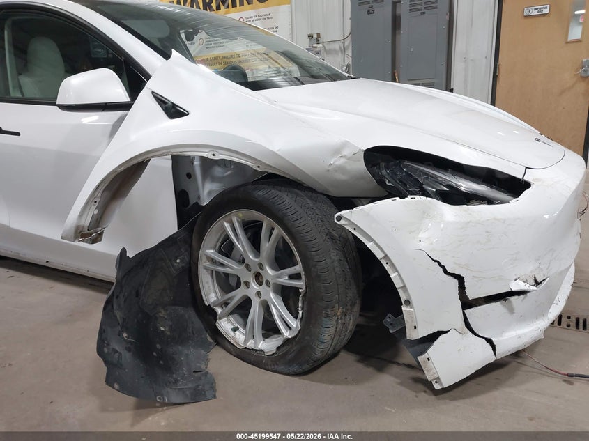 2023 Tesla Model y VIN 7SAYGDEE6PF675621 IAAI salvage auction — SUSPENSION, Salvage (North Dakota), sold $8,900 on 2026-07-24 (photo 6)
