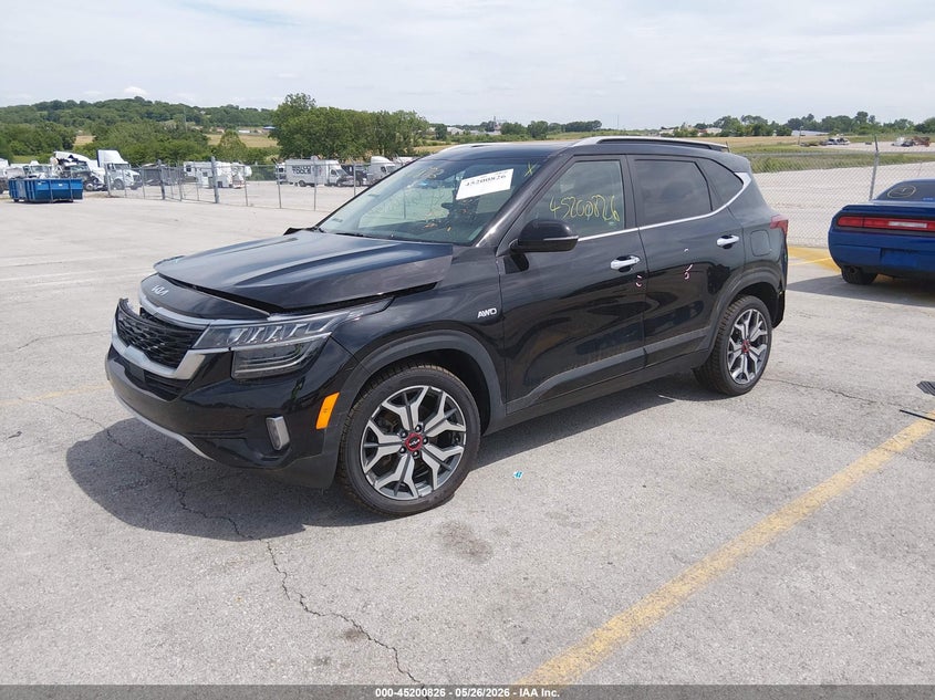 2023 Kia Seltos VIN KNDETCA29P7352896 IAAI salvage auction — FRONT & REAR, Salvage (Kansas), sold $4,775 on 2026-08-01 (photo 2)