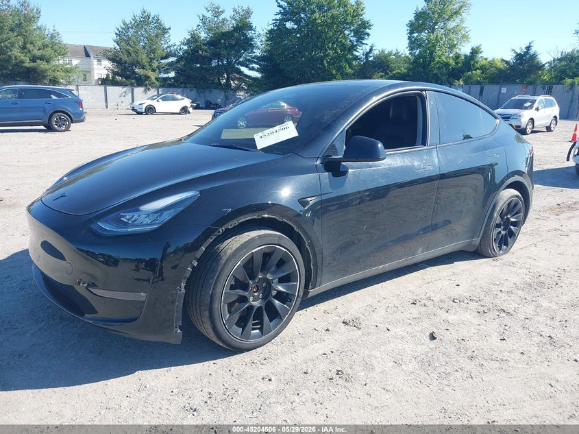 2023 Tesla Model y VIN 7SAYGDEE4PA118705 IAAI salvage auction — SIDE, Salvage Title, sold $13,300 on 2026-07-21 (photo 2)