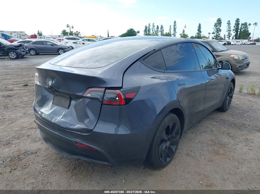 2023 Tesla Model y VIN 7SAYGDED5PF961144 IAAI salvage auction — REAR END, Salvage Title, sold $11,675 on 2026-07-07 (photo 4)