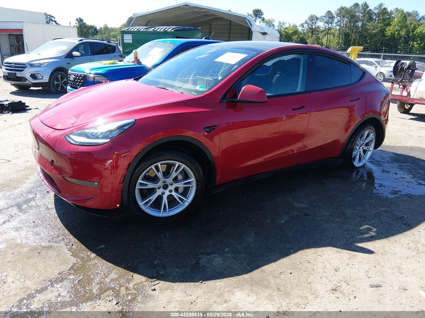 2023 Tesla Model y VIN 7SAYGDEE9PF613033 IAAI salvage auction — FRONT & REAR, Salvage Title, sold $6,600 on 2026-07-17 (photo 2)