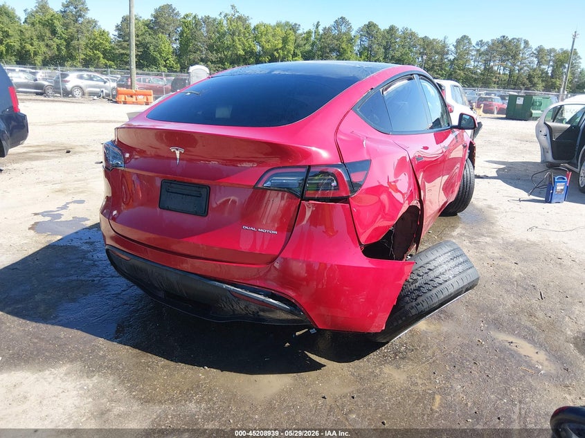 2023 Tesla Model y VIN 7SAYGDEE9PF613033 IAAI salvage auction — FRONT & REAR, Salvage Title, sold $6,600 on 2026-07-17 (photo 4)