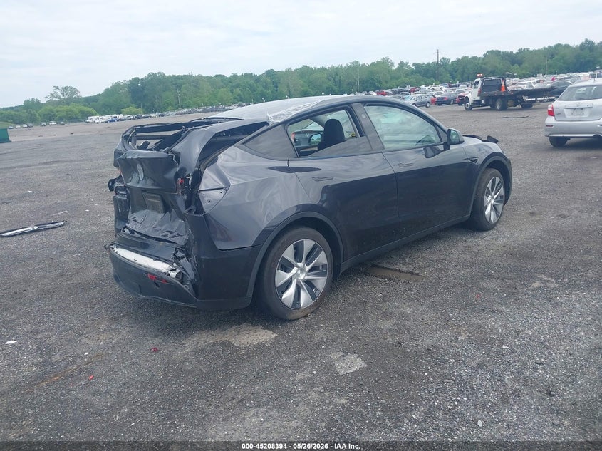 2024 Tesla Model y VIN 7SAYGDED9RF017950 IAAI salvage auction — REAR END, Salvage - Greater Than 75% (Maryland), sold $8,400 on 2026-07-23 (photo 4)
