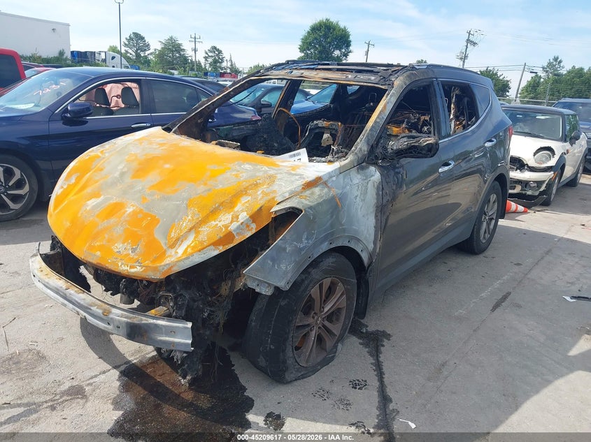 2014 Hyundai Santa fe VIN 5XYZUDLB7EG186010 IAAI salvage auction — TOTAL BURN, Salvage Title, sold $300 on 2026-07-13 (photo 2)