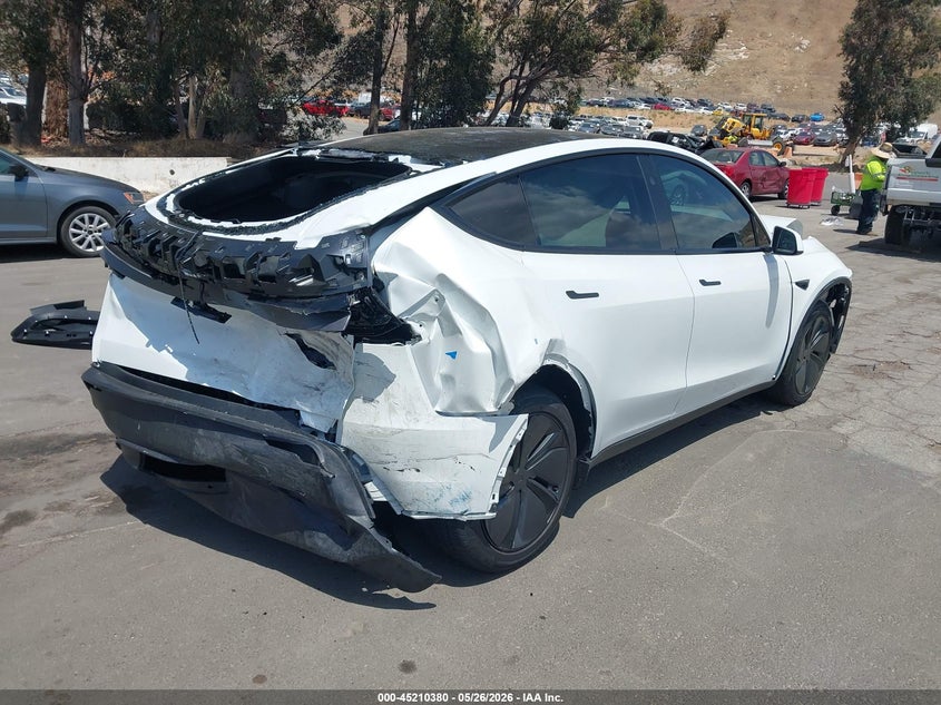 2026 Tesla Model y VIN 7SAYGDED9TF460137 IAAI salvage auction — NORMAL WEAR, Salvage (California), sold $10,000 on 2026-07-07 (photo 4)