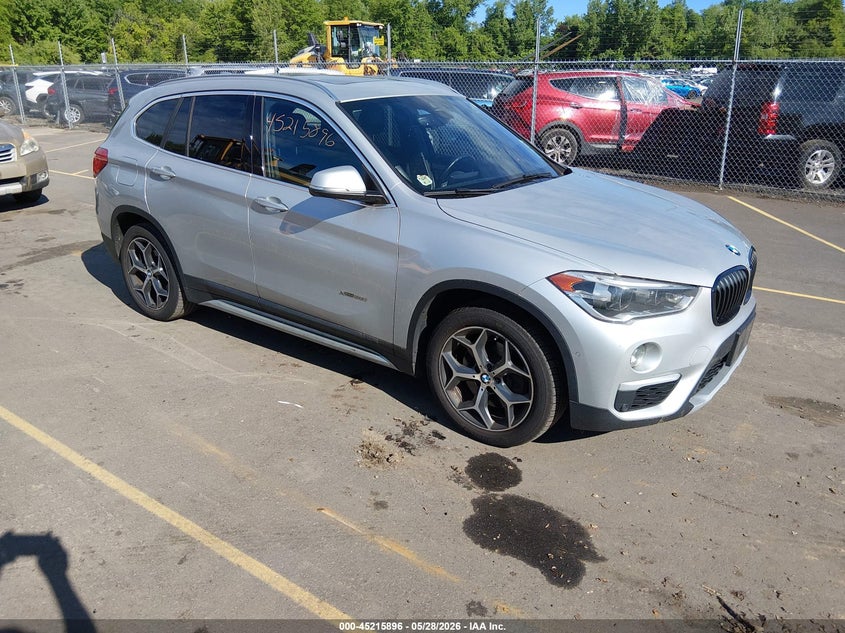 2017 BMW X1 VIN WBXHT3C3XH5F82078 IAAI salvage auction — NORMAL WEAR, Salvage Title, sold $2,250 on 2026-07-16 (photo 1)
