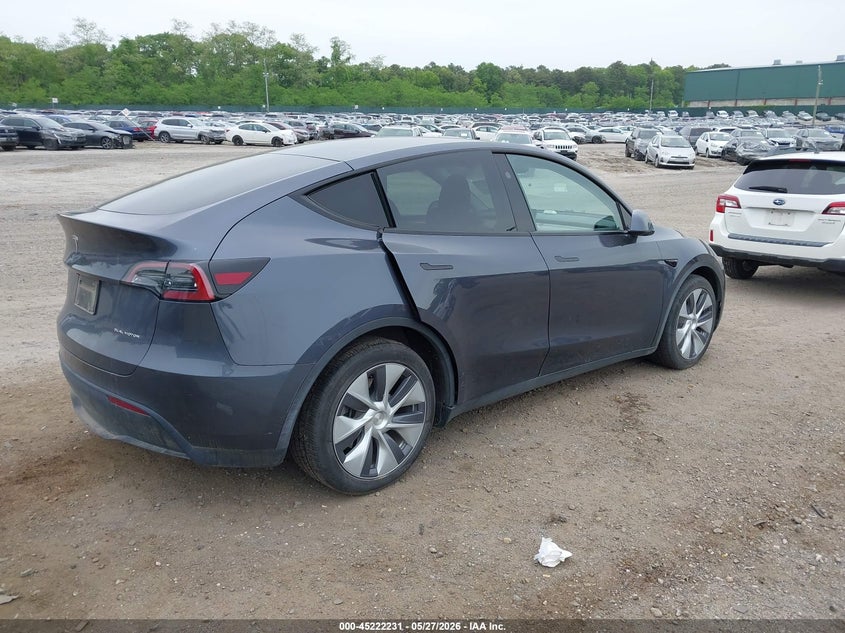 2023 Tesla Model y VIN 7SAYGDEE8PF845638 IAAI salvage auction — WATER/FLOOD, Mv-907A (New York), sold $9,100 on 2026-07-23 (photo 4)