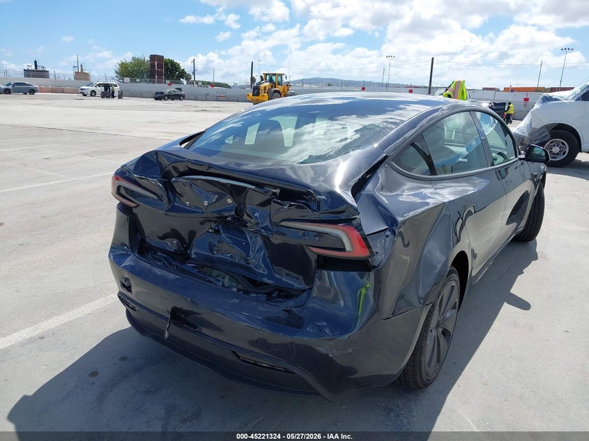 2025 Tesla Model 3 VIN 5YJ3E1EA1SF920925 IAAI salvage auction — FRONT & REAR, Salvage Title, sold $9,600 on 2026-07-06 (photo 6)