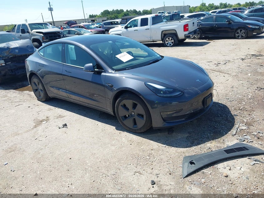 2023 Tesla Model 3 VIN 5YJ3E1EA4PF697187 IAAI salvage auction — SIDE, Salvage Title, sold $8,300 on 2026-07-10 (photo 1)