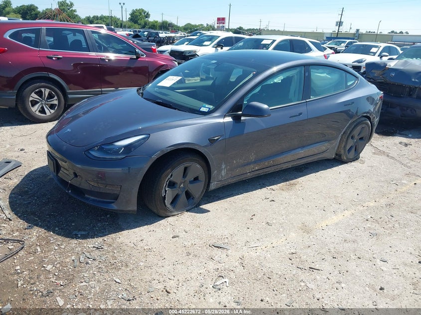 2023 Tesla Model 3 VIN 5YJ3E1EA4PF697187 IAAI salvage auction — SIDE, Salvage Title, sold $8,300 on 2026-07-10 (photo 2)
