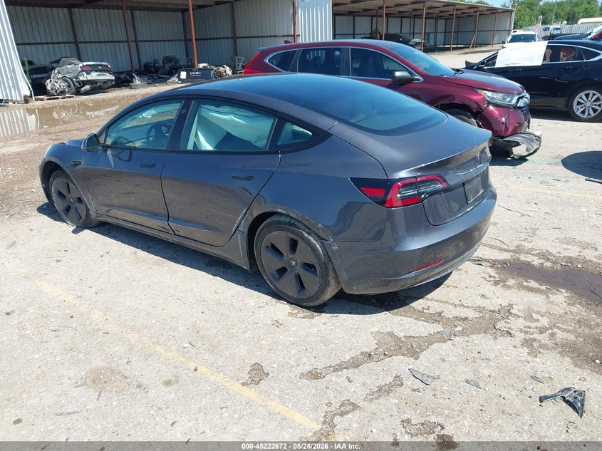 2023 Tesla Model 3 VIN 5YJ3E1EA4PF697187 IAAI salvage auction — SIDE, Salvage Title, sold $8,300 on 2026-07-10 (photo 3)