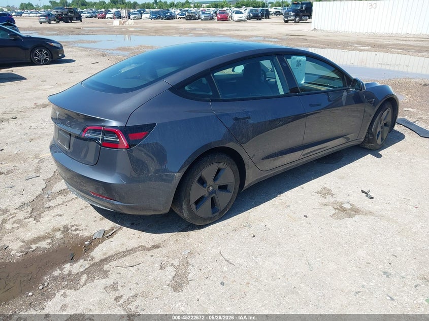2023 Tesla Model 3 VIN 5YJ3E1EA4PF697187 IAAI salvage auction — SIDE, Salvage Title, sold $8,300 on 2026-07-10 (photo 4)