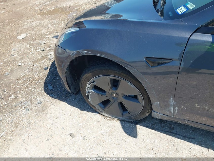 2023 Tesla Model 3 VIN 5YJ3E1EA4PF697187 IAAI salvage auction — SIDE, Salvage Title, sold $8,300 on 2026-07-10 (photo 6)