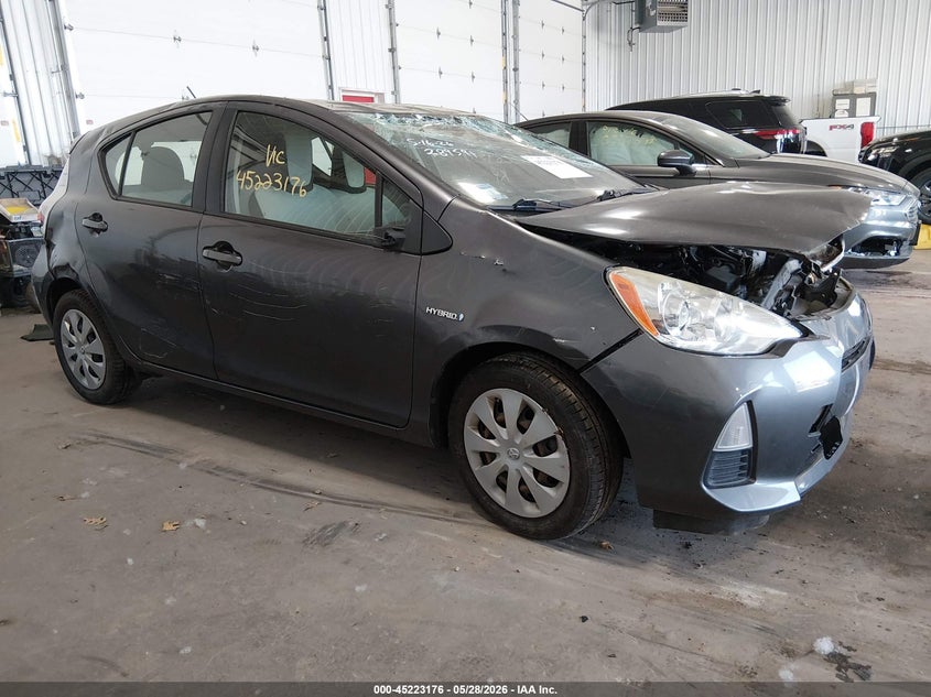 2014 Toyota Prius c VIN JTDKDTB30E1563086 IAAI salvage auction — UNKNOWN, Prior Salvage (Minnesota), sold $350 on 2026-07-29 (photo 1)