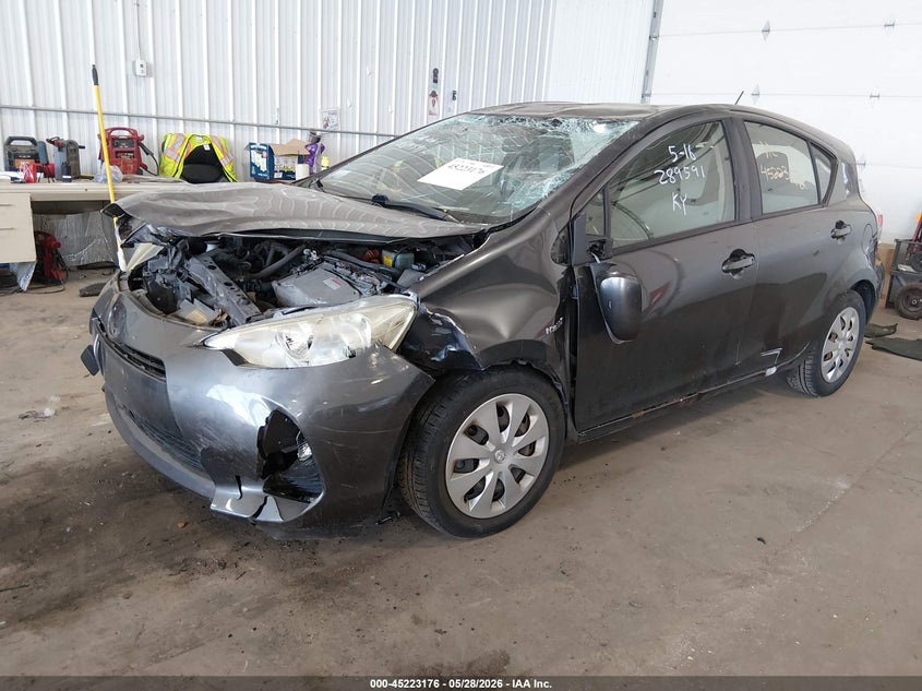 2014 Toyota Prius c VIN JTDKDTB30E1563086 IAAI salvage auction — UNKNOWN, Prior Salvage (Minnesota), sold $350 on 2026-07-29 (photo 2)