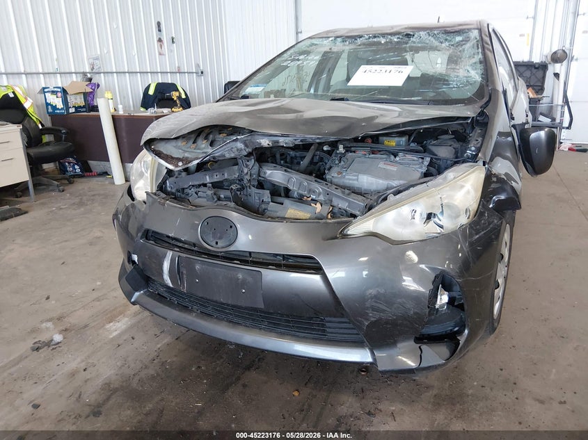 2014 Toyota Prius c VIN JTDKDTB30E1563086 IAAI salvage auction — UNKNOWN, Prior Salvage (Minnesota), sold $350 on 2026-07-29 (photo 6)