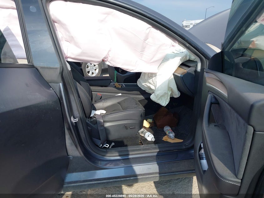 2023 Tesla Model y VIN 7SAYGDEFXPF802279 IAAI salvage auction — BIO HAZARD, Salvage Title, sold $9,550 on 2026-07-23 (photo 5)