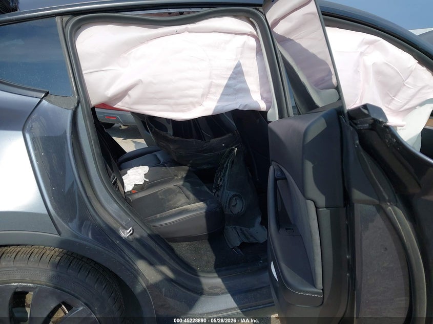 2023 Tesla Model y VIN 7SAYGDEFXPF802279 IAAI salvage auction — BIO HAZARD, Salvage Title, sold $9,550 on 2026-07-23 (photo 8)