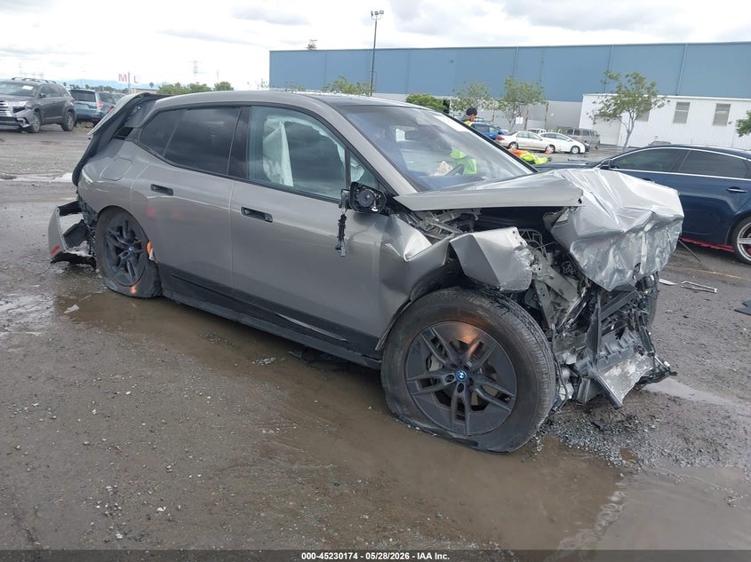 2023 BMW Ix VIN WB523CF03PCM19294 IAAI salvage auction — FRONT & REAR, Salvage (California), sold $5,200 on 2026-07-06 (photo 1)