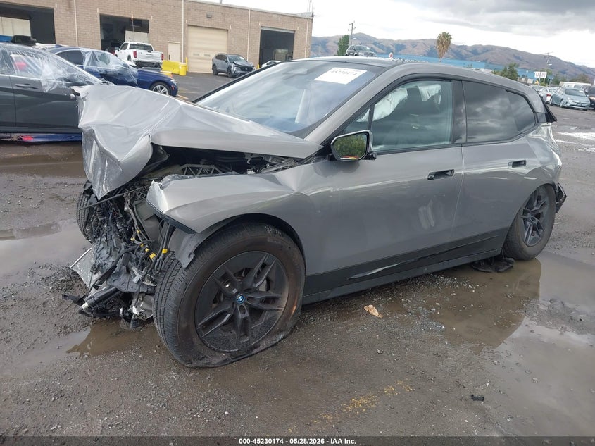 2023 BMW Ix VIN WB523CF03PCM19294 IAAI salvage auction — FRONT & REAR, Salvage (California), sold $5,200 on 2026-07-06 (photo 2)