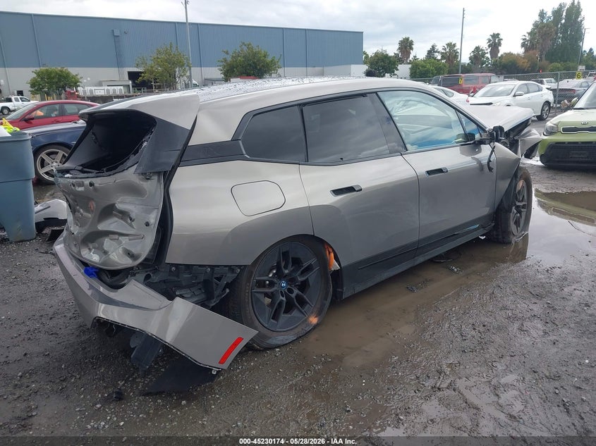 2023 BMW Ix VIN WB523CF03PCM19294 IAAI salvage auction — FRONT & REAR, Salvage (California), sold $5,200 on 2026-07-06 (photo 4)
