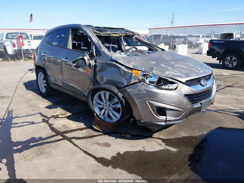2012 Hyundai Tucson VIN KM8JUCAC8CU538005 IAAI salvage auction — ROLLOVER, Salvage Title, sold $300 on 2026-07-09 (photo 1)