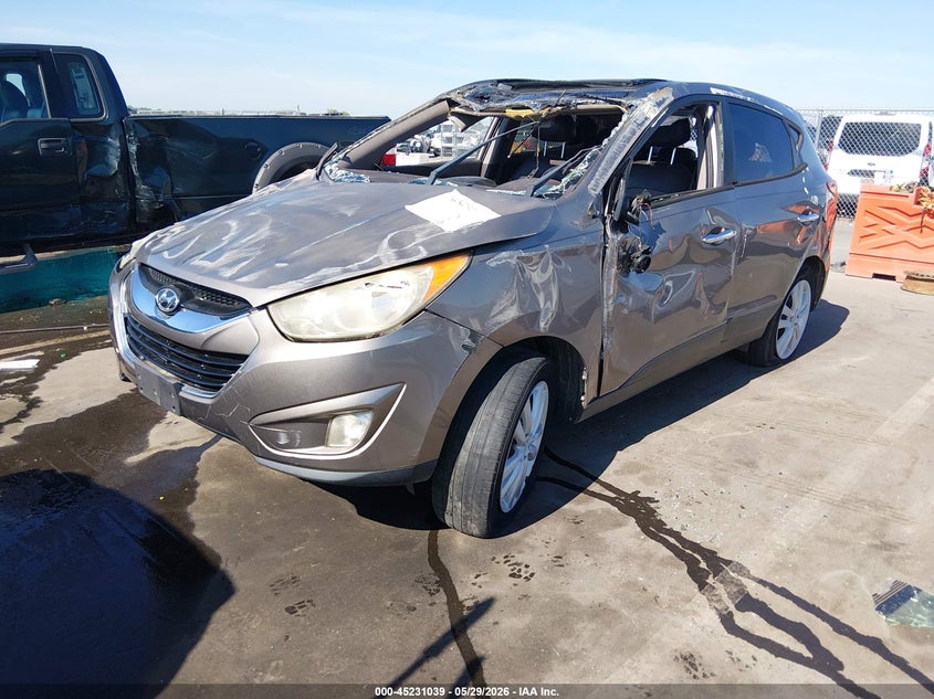 2012 Hyundai Tucson VIN KM8JUCAC8CU538005 IAAI salvage auction — ROLLOVER, Salvage Title, sold $300 on 2026-07-09 (photo 2)