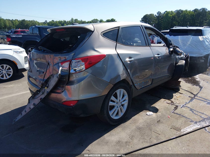 2012 Hyundai Tucson VIN KM8JUCAC8CU538005 IAAI salvage auction — ROLLOVER, Salvage Title, sold $300 on 2026-07-09 (photo 4)