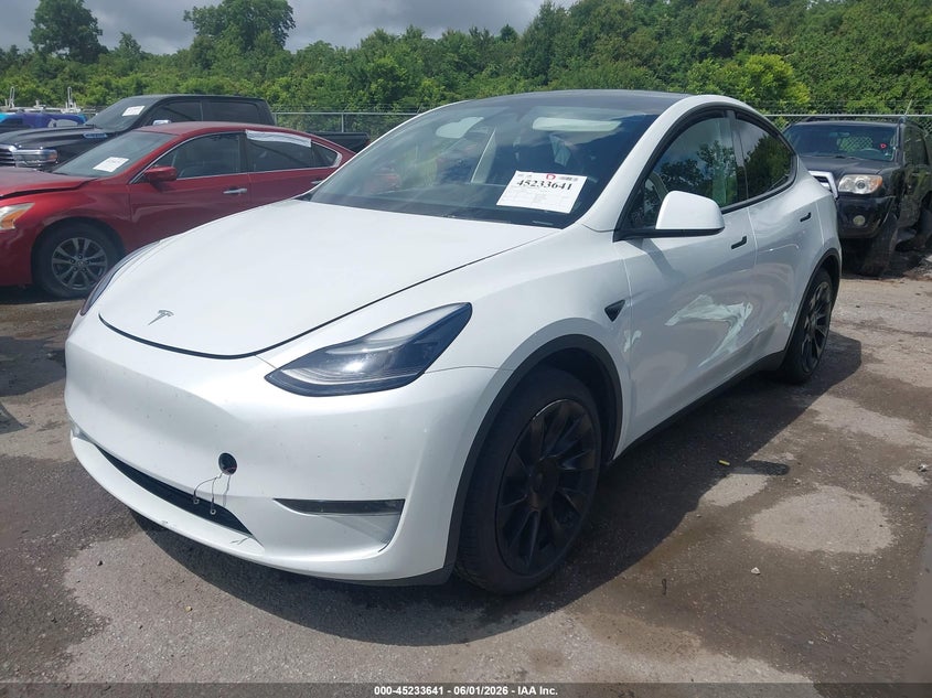 2023 Tesla Model y VIN 7SAYGAEE4PF864525 IAAI salvage auction — SIDE, Salvage (Louisiana), sold $11,250 on 2026-07-07 (photo 2)