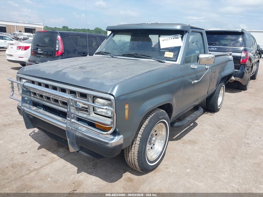 1987 Ford Ranger VIN 1FTBR10AXHUB52305 IAAI salvage auction — REAR END, Clear (Oklahoma), sold $575 on 2026-07-08 (photo 2)