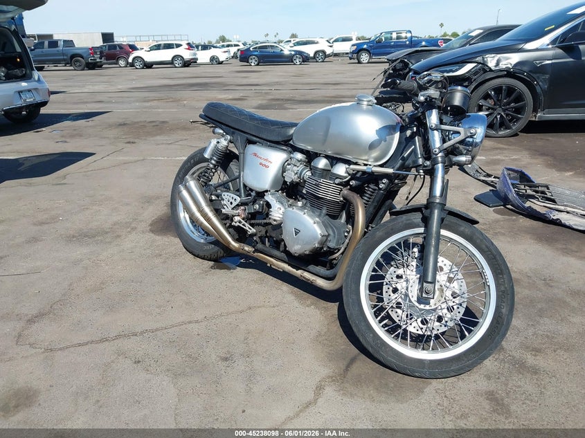 2013 Triumph motorcycle Thruxton VIN SMT920K19DT570186 IAAI salvage auction — Unknown, Salvage (Arizona), sold $375 on 2026-07-21 (photo 1)