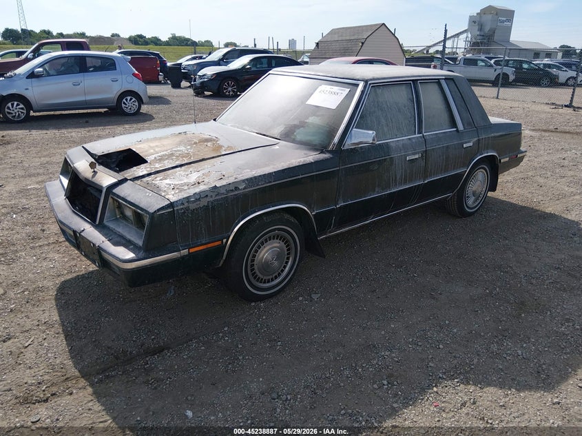 1985 Chrysler Lebaron VIN 1C3BC56D3FF201537 IAAI salvage auction — ENGINE BURN, Salvage (Illinois), sold $200 on 2026-07-08 (photo 2)