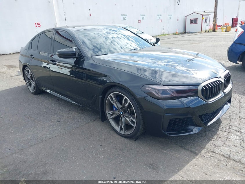 2021 BMW M550i xDrive VIN WBA13BK01MCF15677 — IAAI salvage auction photo